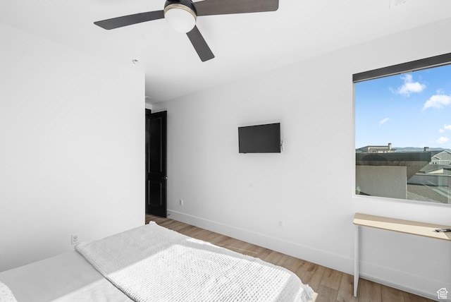 5488 N Valley Rd E, Lehi, UT 84043 - bedroom with wood finished floors and a ceiling fan
