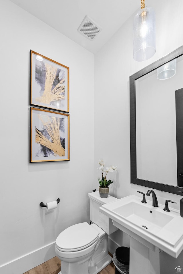 5488 N Valley Rd E, Lehi, UT 84043 - bathroom featuring wood finished floors and toilet