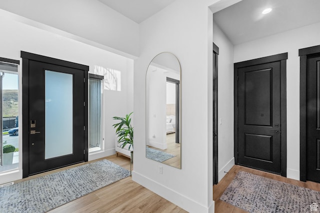 5488 N Valley Rd E, Lehi, UT 84043 - entrance foyer with light wood-style floors and arched walkways