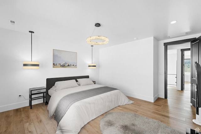 5488 N Valley Rd E, Lehi, UT 84043 - bedroom featuring light wood-style flooring, attic access, and recessed lighting