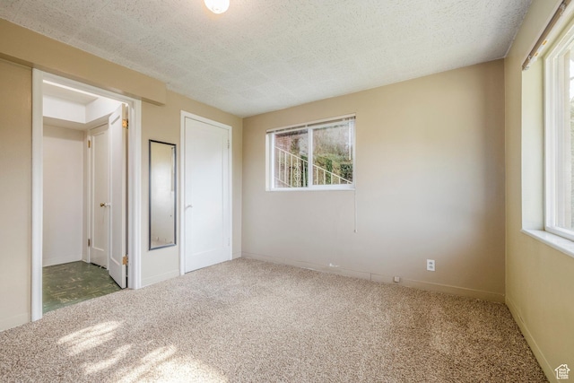 420 E 12th Ave, Salt Lake City, UT 84103 - unfurnished bedroom with carpet flooring and a textured ceiling