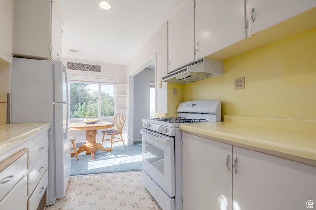 420 E 12th Ave, Salt Lake City, UT 84103 - kitchen featuring white appliances, under cabinet range hood, white cabinets, light countertops, and light floors