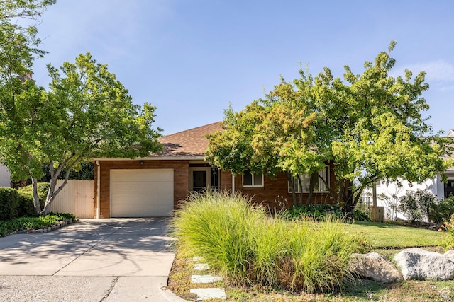 420 E 12th Ave, Salt Lake City, UT 84103 - view of front of house featuring a garage and driveway