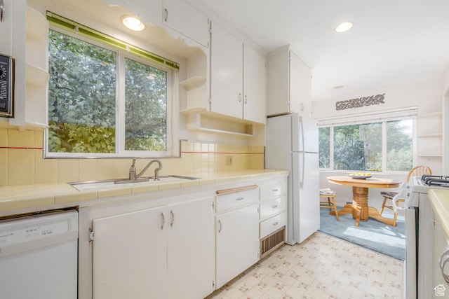 420 E 12th Ave, Salt Lake City, UT 84103 - kitchen with white appliances, open shelves, white cabinets, tile counters, and light floors