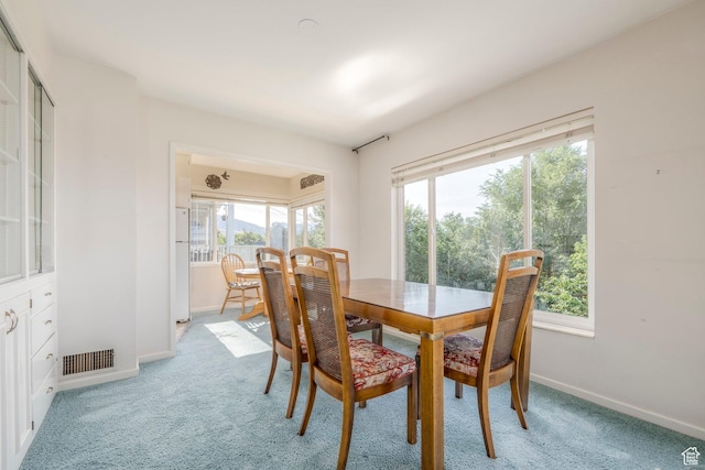 420 E 12th Ave, Salt Lake City, UT 84103 - dining space featuring light colored carpet and healthy amount of natural light