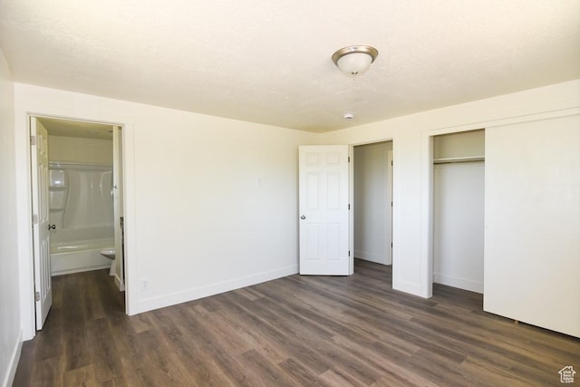 327 N 600 W, Grantsville, UT 84029 - unfurnished bedroom featuring dark wood-style floors, a closet, and ensuite bath