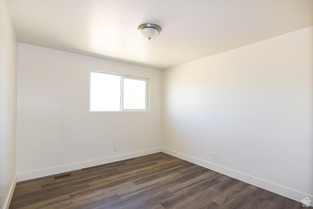 327 N 600 W, Grantsville, UT 84029 - spare room with baseboards and dark wood-style floors