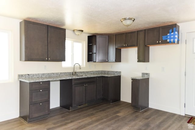327 N 600 W, Grantsville, UT 84029 - kitchen with dark brown cabinets, dark wood finished floors, and light stone counters