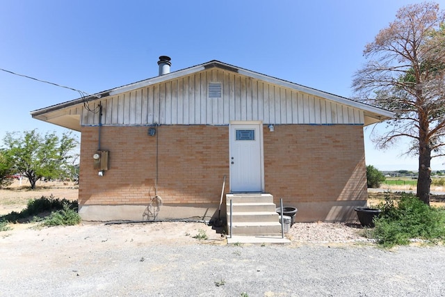 327 N 600 W, Grantsville, UT 84029 - view of front of home with entry steps, brick siding, and board and batten siding