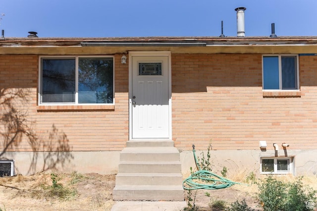 327 N 600 W, Grantsville, UT 84029 - view of exterior entry featuring brick siding