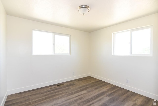 327 N 600 W, Grantsville, UT 84029 - spare room featuring baseboards and dark wood-style floors