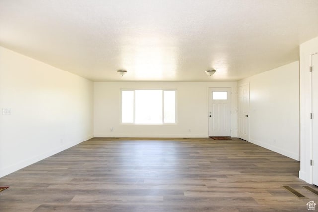 327 N 600 W, Grantsville, UT 84029 - unfurnished living room with baseboards and wood finished floors