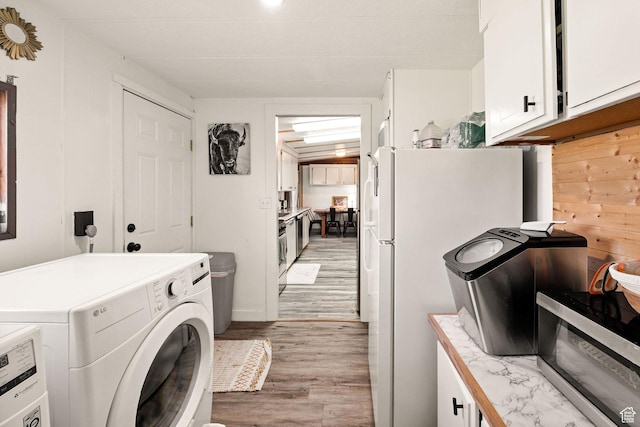 20105 N 5000 W, Plymouth, UT 84330 - laundry room with washer / dryer and light wood-style flooring