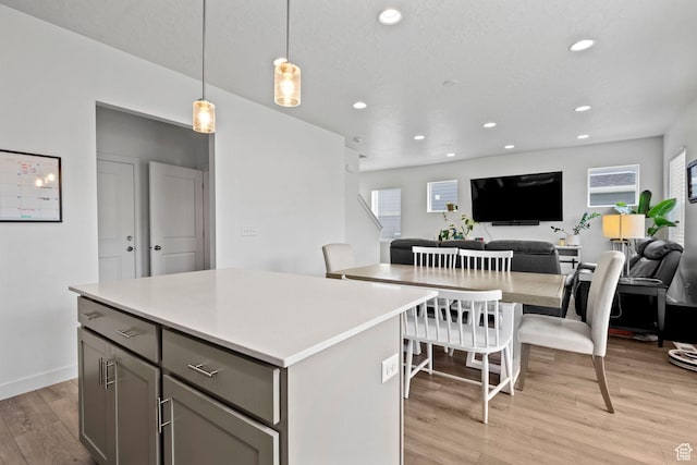 1162 W 1100 S, Clearfield, UT 84015 - kitchen featuring gray cabinetry, light wood-type flooring, recessed lighting, light countertops, and a center island