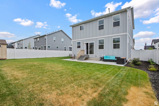 1162 W 1100 S, Clearfield, UT 84015 - back of house with board and batten siding, entry steps, outdoor lounge area, a patio, and a fenced backyard