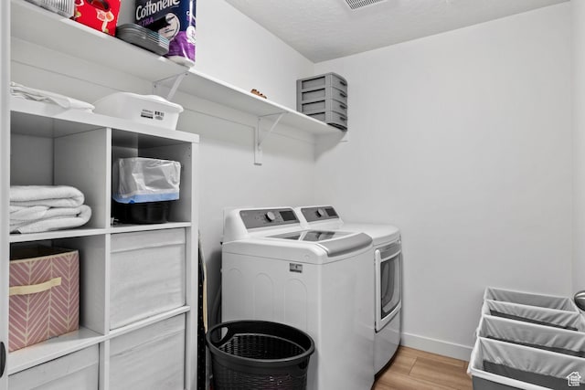 1162 W 1100 S, Clearfield, UT 84015 - laundry room with washer and dryer and light wood finished floors