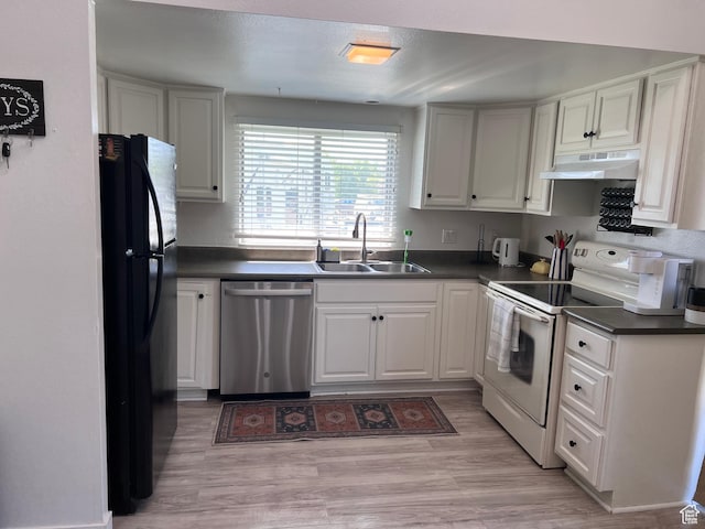 695 N Orange Ct, Castle Dale, UT 84513 - kitchen featuring stainless steel dishwasher, white electric range oven, freestanding refrigerator, under cabinet range hood, and dark countertops