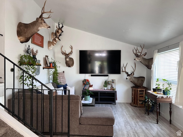 695 N Orange Ct, Castle Dale, UT 84513 - living area with lofted ceiling, wood finished floors, and stairs