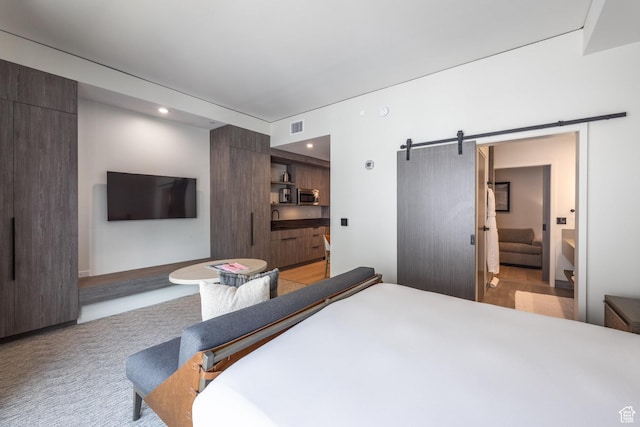 2417 W High Mountain Rd Unit 2416, Park City, UT 84098 - bedroom featuring a barn door, recessed lighting, and light colored carpet