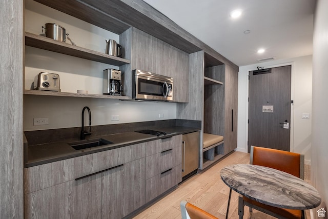 2417 W High Mountain Rd Unit 2416, Park City, UT 84098 - kitchen featuring open shelves, stainless steel microwave, dark countertops, light wood-style floors, and recessed lighting