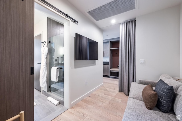 2417 W High Mountain Rd Unit 2416, Park City, UT 84098 - corridor featuring a barn door and light wood-style floors