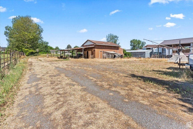 7738 S 2700 W, West Jordan, UT 84084 - view of yard with a carport and an outbuilding