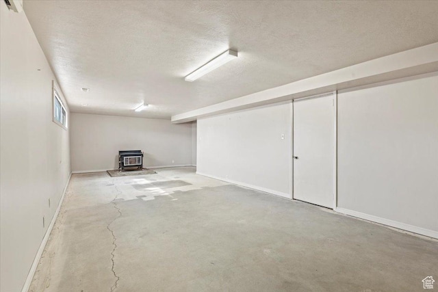 7738 S 2700 W, West Jordan, UT 84084 - below grade area with a wood stove and a textured ceiling