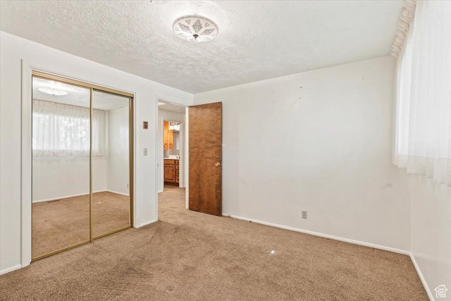 7738 S 2700 W, West Jordan, UT 84084 - unfurnished bedroom with carpet floors, a closet, and a textured ceiling