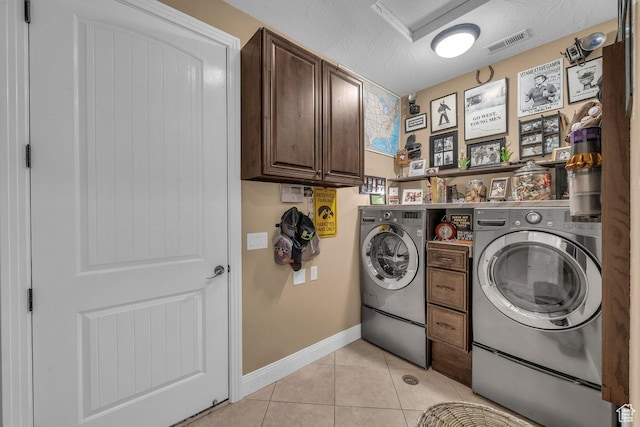 38 W 1725 S, Washington, UT 84780 - washroom with washer and dryer, light tile patterned floors, cabinet space, and a textured ceiling