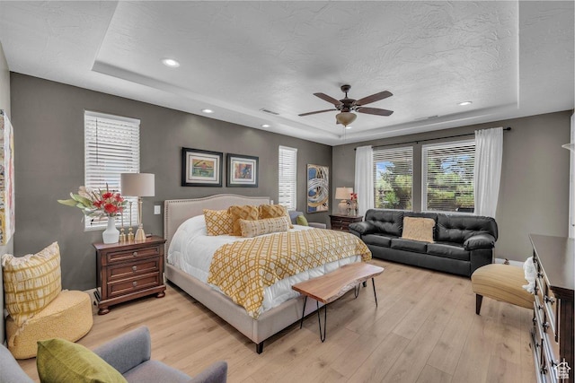 38 W 1725 S, Washington, UT 84780 - bedroom featuring a raised ceiling, light wood-style flooring, a textured ceiling, recessed lighting, and a ceiling fan