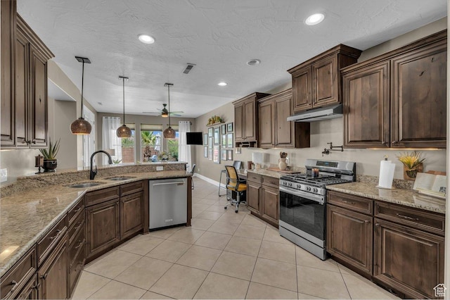 38 W 1725 S, Washington, UT 84780 - kitchen featuring stainless steel appliances, under cabinet range hood, a ceiling fan, light tile patterned flooring, and decorative light fixtures