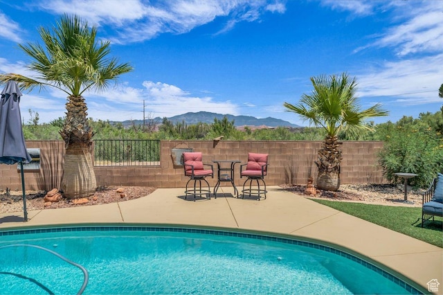 38 W 1725 S, Washington, UT 84780 - view of swimming pool featuring a mountain view and a patio