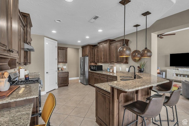 38 W 1725 S, Washington, UT 84780 - kitchen featuring appliances with stainless steel finishes, ceiling fan, light tile patterned floors, light stone countertops, and recessed lighting
