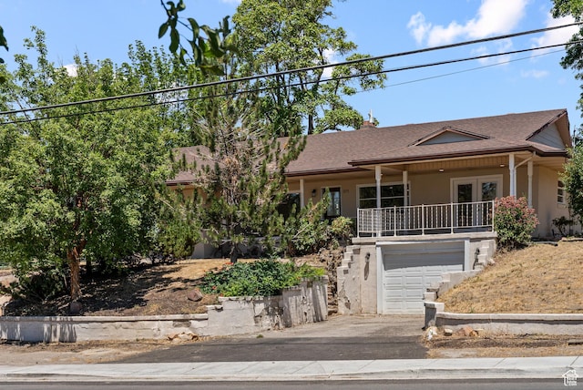 1175 E 900 N, Lehi, UT 84043 - view of front facade with french doors, an attached garage, stucco siding, roof with shingles, and asphalt driveway