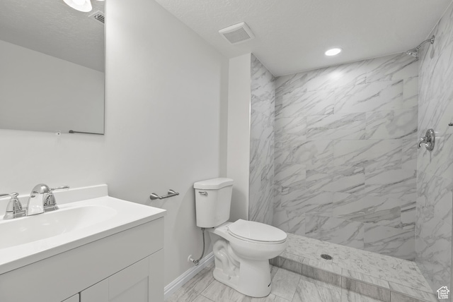 1175 E 900 N, Lehi, UT 84043 - bathroom featuring vanity, a marble finish shower, marble look tiles, recessed lighting, and a textured ceiling