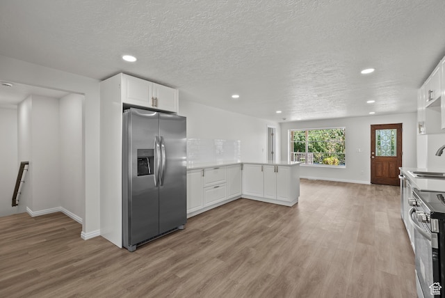 1175 E 900 N, Lehi, UT 84043 - kitchen with appliances with stainless steel finishes, recessed lighting, light wood-style flooring, a peninsula, and light countertops