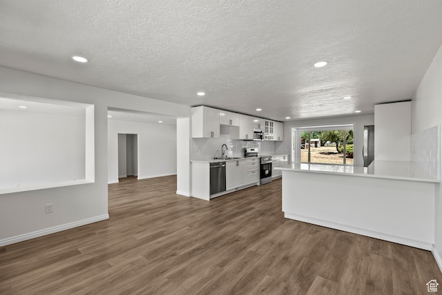 1175 E 900 N, Lehi, UT 84043 - kitchen featuring stainless steel appliances, wood finished floors, white cabinets, light countertops, and recessed lighting