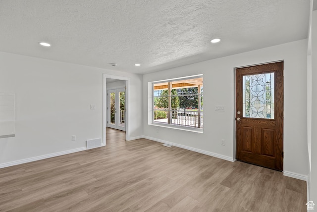 1175 E 900 N, Lehi, UT 84043 - foyer entrance featuring a textured ceiling, light wood-type flooring, healthy amount of natural light, and recessed lighting