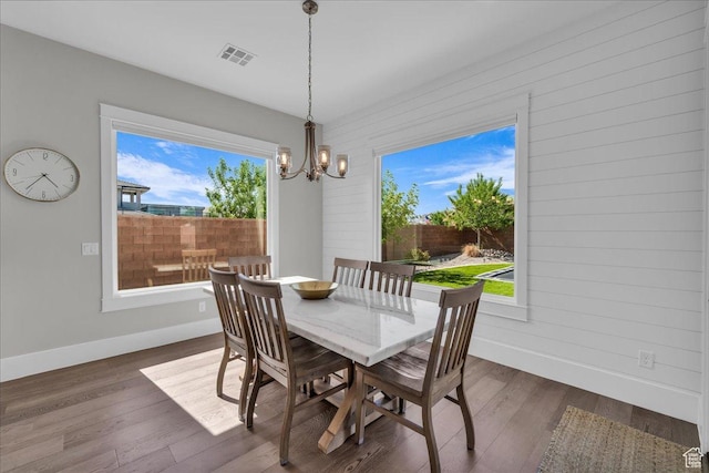 2249 E Fieldstone Cir, St George, UT 84790 - dining area with healthy amount of natural light, dark wood finished floors, and a chandelier