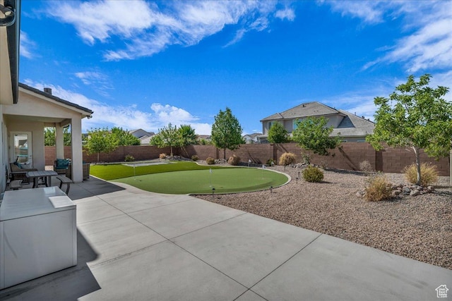 2249 E Fieldstone Cir, St George, UT 84790 - fenced backyard with a putting green and a patio