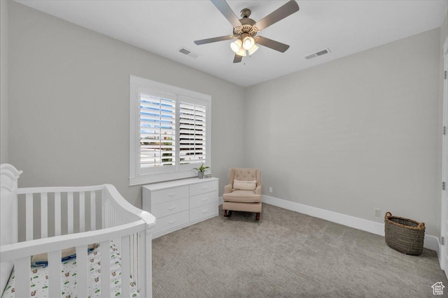 2249 E Fieldstone Cir, St George, UT 84790 - bedroom with light colored carpet, a ceiling fan, and a crib