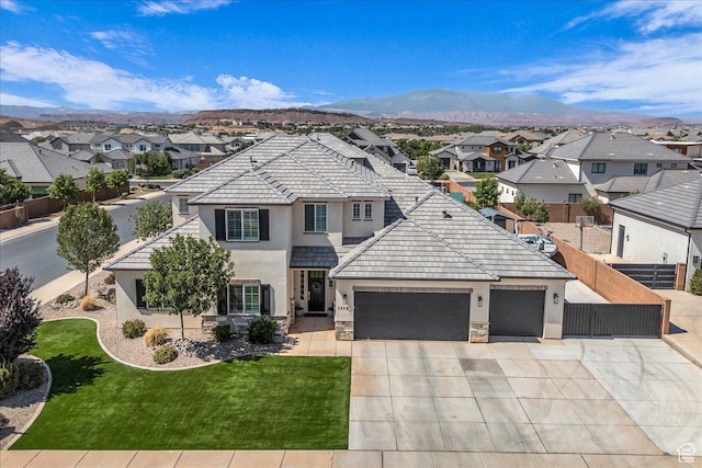 2249 E Fieldstone Cir, St George, UT 84790 - traditional home with a residential view, stucco siding, an attached garage, and driveway