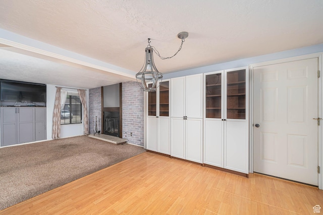 564 S 940 W, Cedar City, UT 84720 - unfurnished living room featuring a fireplace and light wood-style floors
