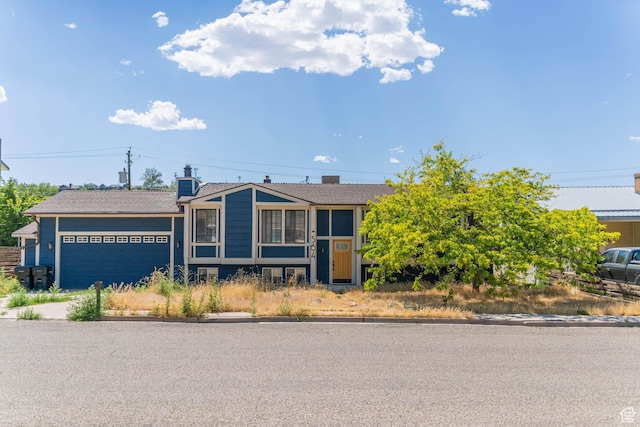 564 S 940 W, Cedar City, UT 84720 - view of front facade with a garage and a chimney