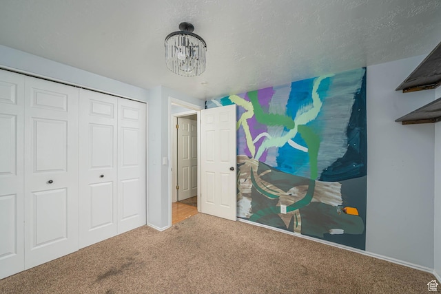 564 S 940 W, Cedar City, UT 84720 - unfurnished bedroom with carpet floors, a closet, and a chandelier