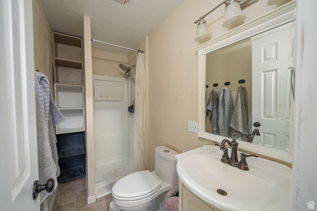 564 S 940 W, Cedar City, UT 84720 - full bathroom featuring vanity, a stall shower, a textured wall, and tile patterned floors