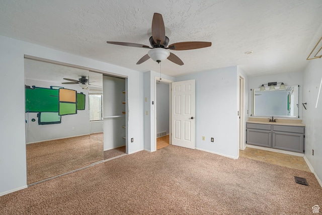 564 S 940 W, Cedar City, UT 84720 - unfurnished bedroom featuring carpet floors, a textured ceiling, and a ceiling fan