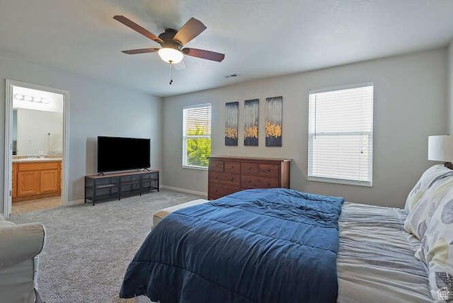 7526 S Park Maple Dr, West Jordan, UT 84081 - bedroom featuring light colored carpet, ensuite bath, and a ceiling fan