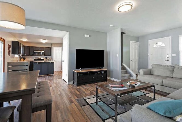 7526 S Park Maple Dr, West Jordan, UT 84081 - living area featuring dark wood-style floors and baseboards