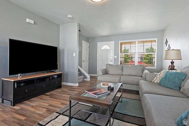 7526 S Park Maple Dr, West Jordan, UT 84081 - living room with wood finished floors and stairway
